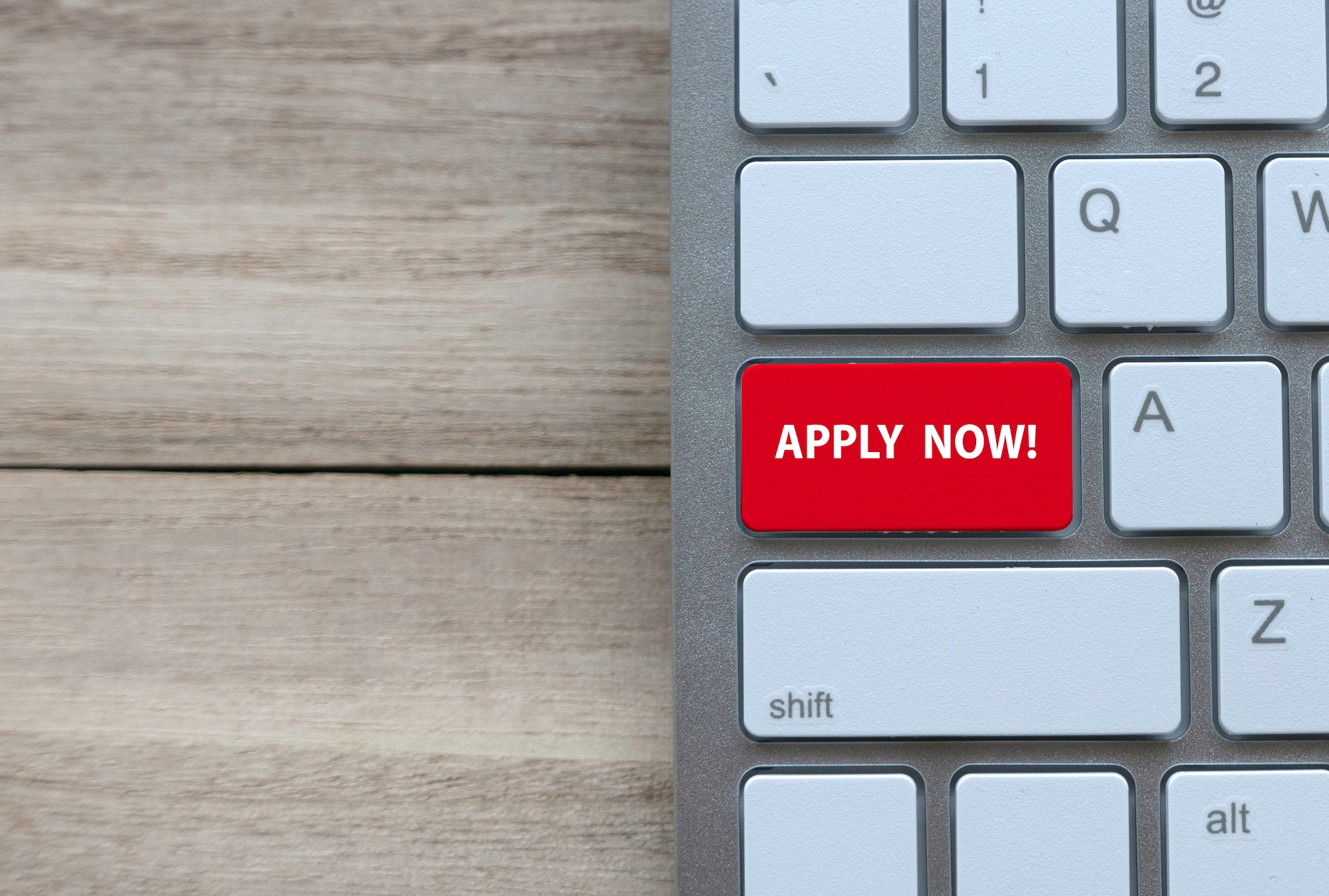 "Apply now" Red Button on side of keyboard depicting our blog optimising job postings online for maximum visibility.